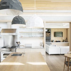 Modern pendant lights over wood kitchen island